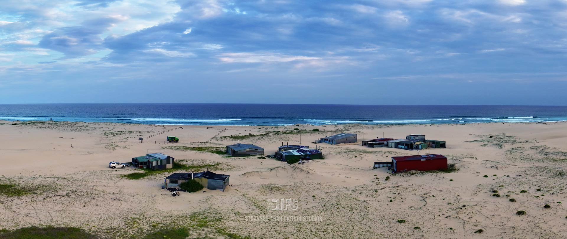 Panoramic Drone Image Showing The Fisherman's Huts Of Tin City On Stockton Beach In Port Stephens NSW.